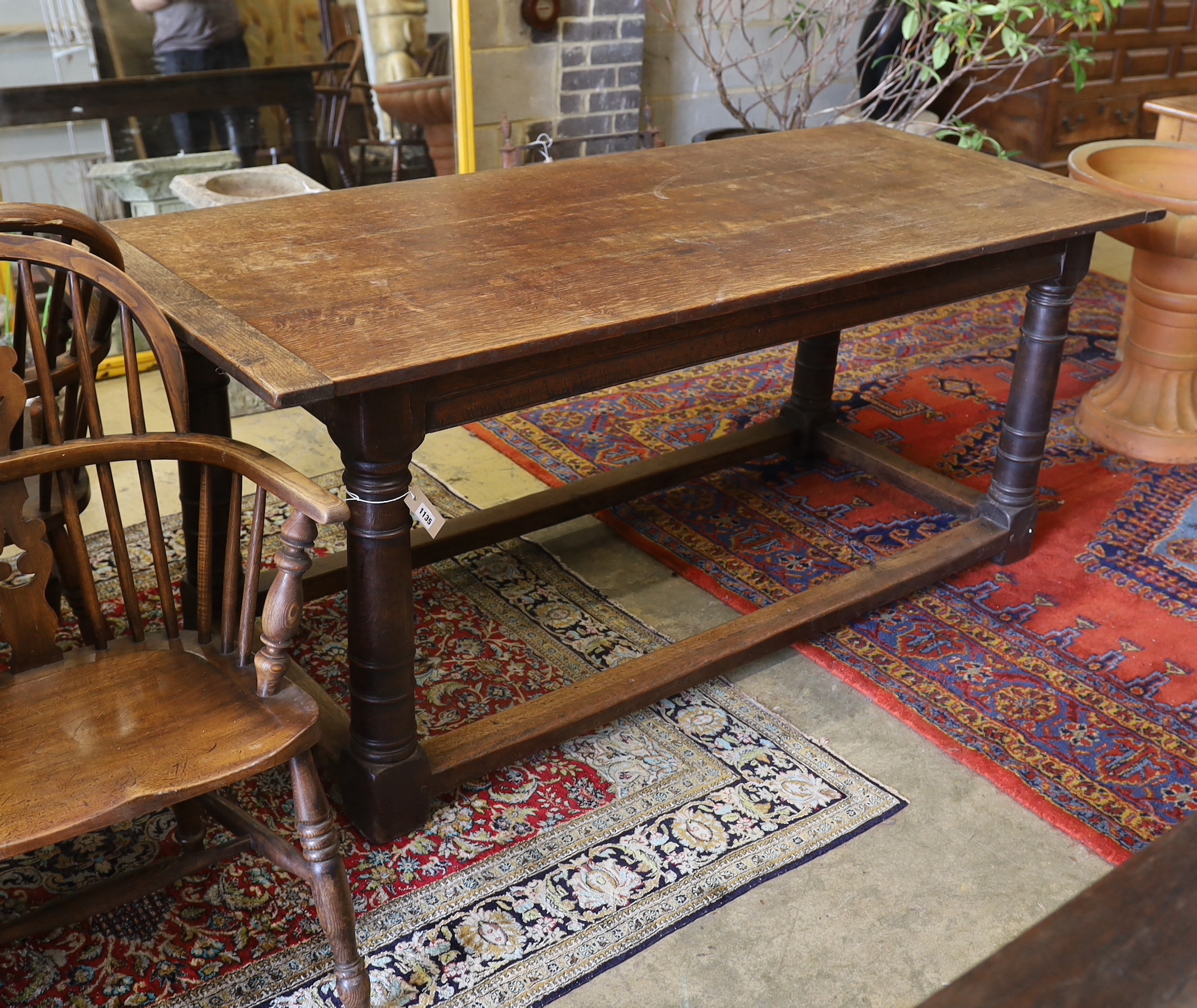 An 18th century and later rectangular oak refectory dining table, width 183cm, depth 79cm, height 77cm